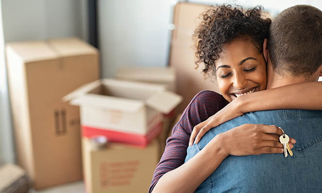 03-happy-woman-holding-keys-to-new-home