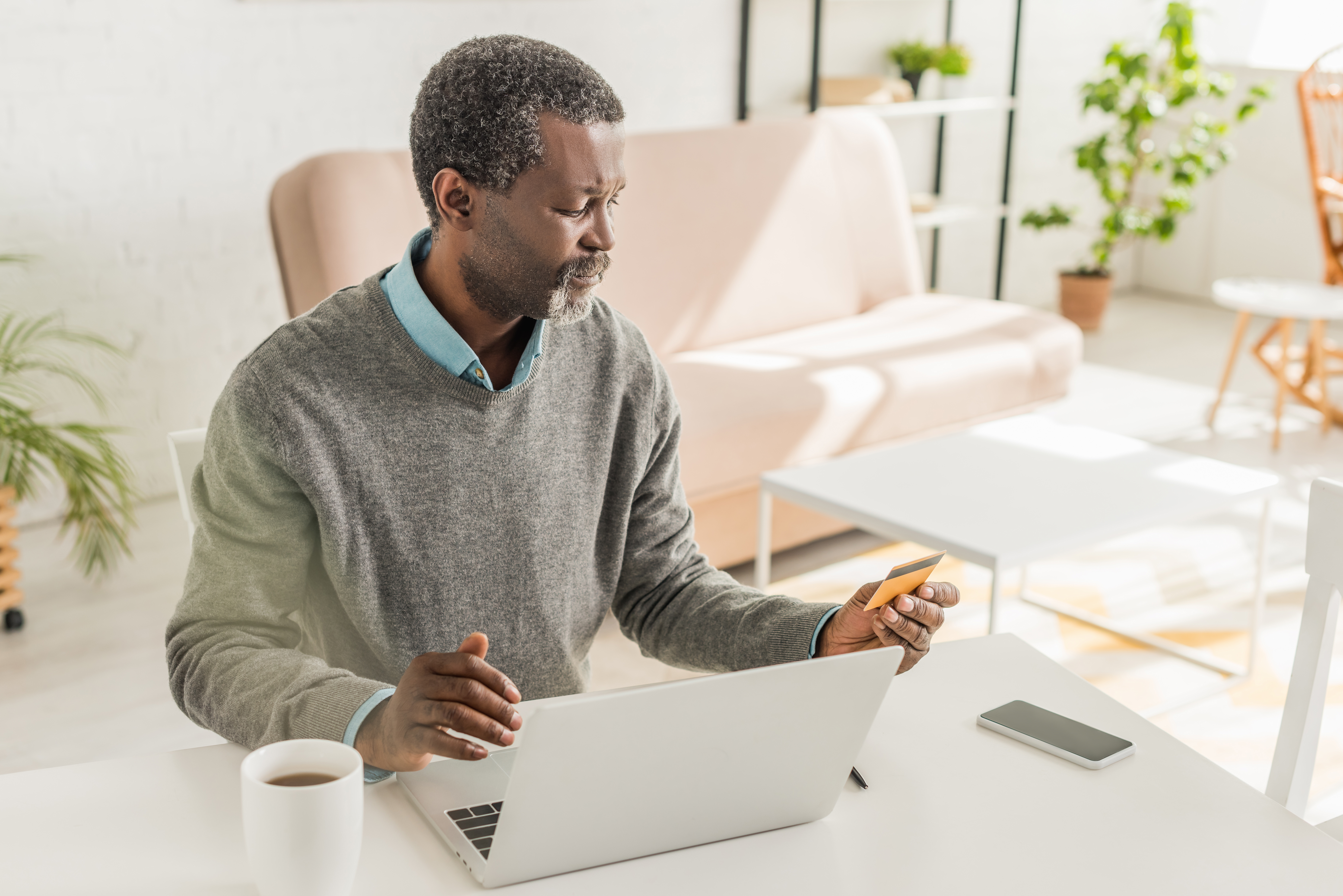senior-african-american-man-sitting-credit-card